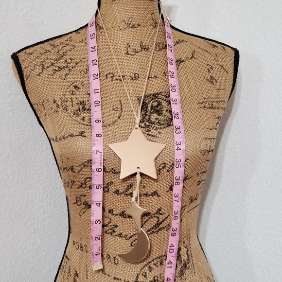 Silvertone and goldtone matte metal Star twinkle and moon black cord necklace - Picture 3 of 4